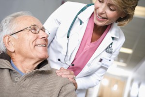 Image of a doctor talking with senior patient.
